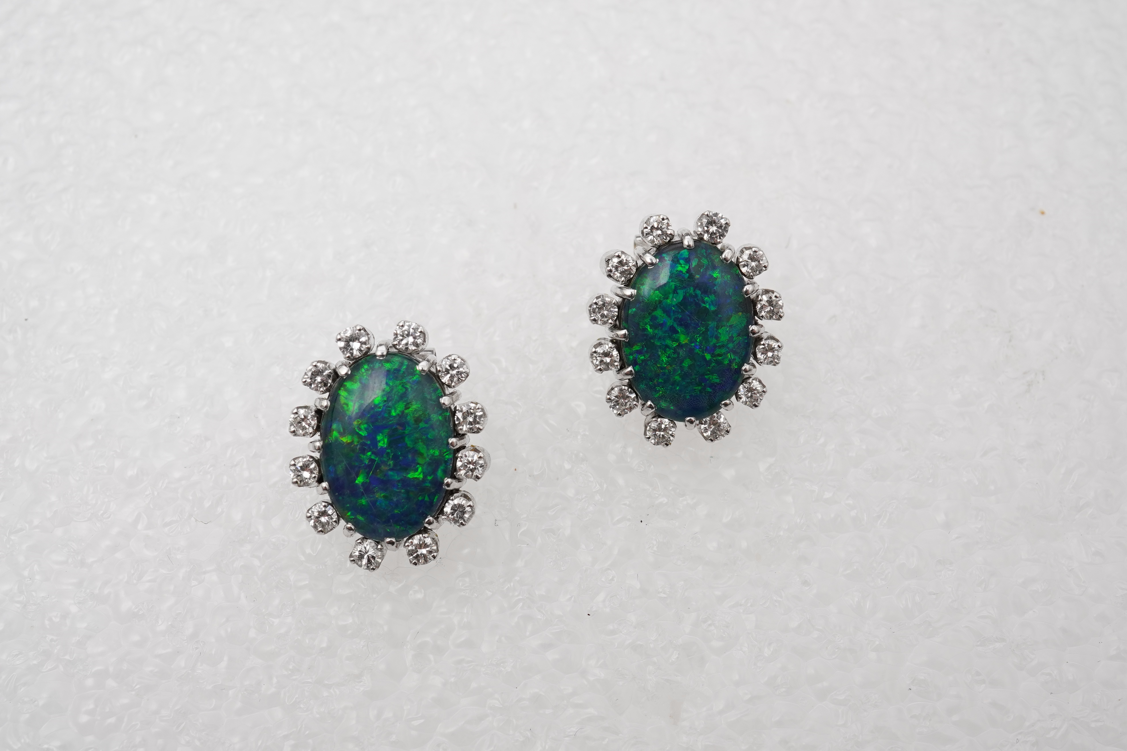 A pair of opal triplet and diamond earrings